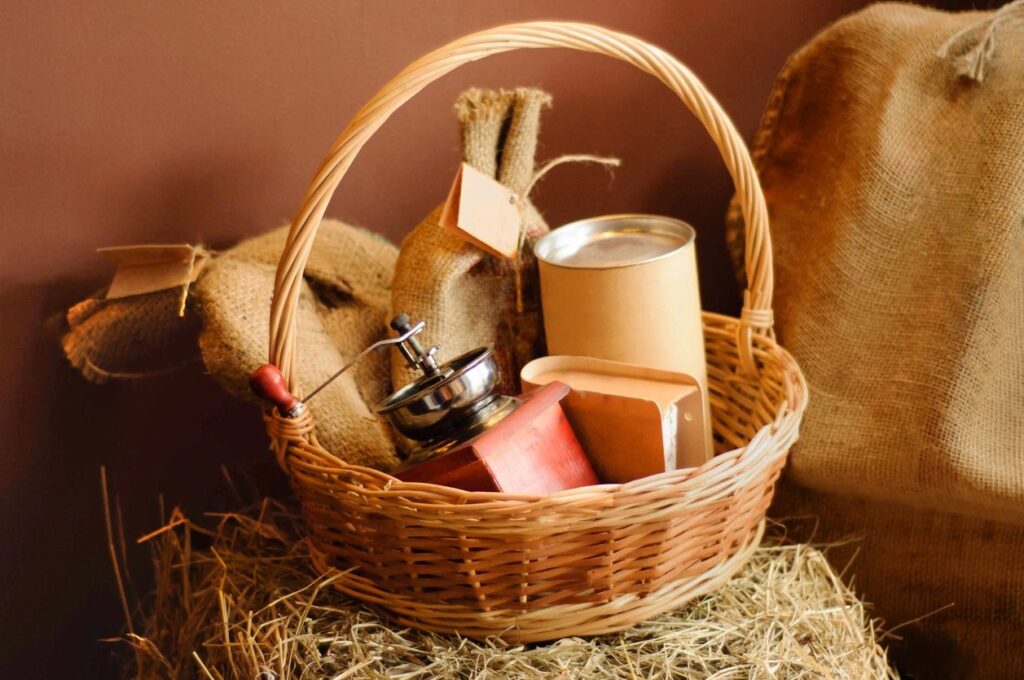 Woven basket with a pump canister and other wrapped gifts.